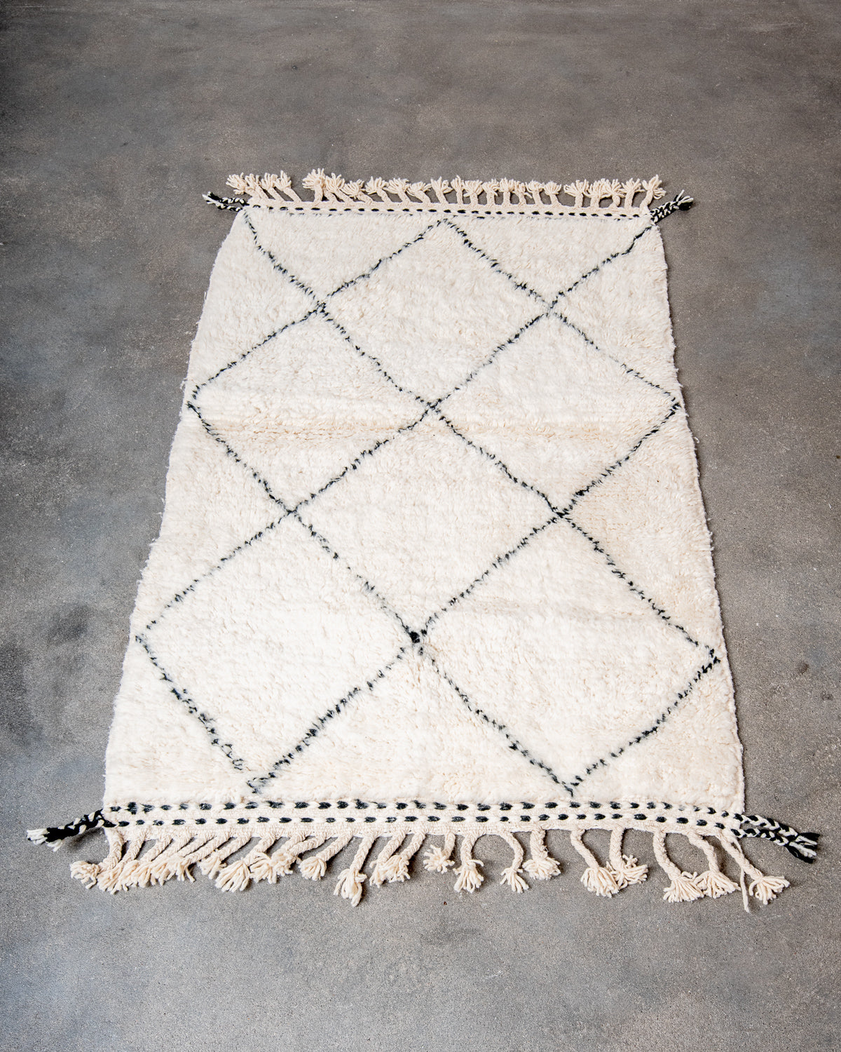 Modern, designer, handcrafted Berber rug from Morocco. Beniourain carpet with minimalist design, natural wool pile and a fluffy texture.